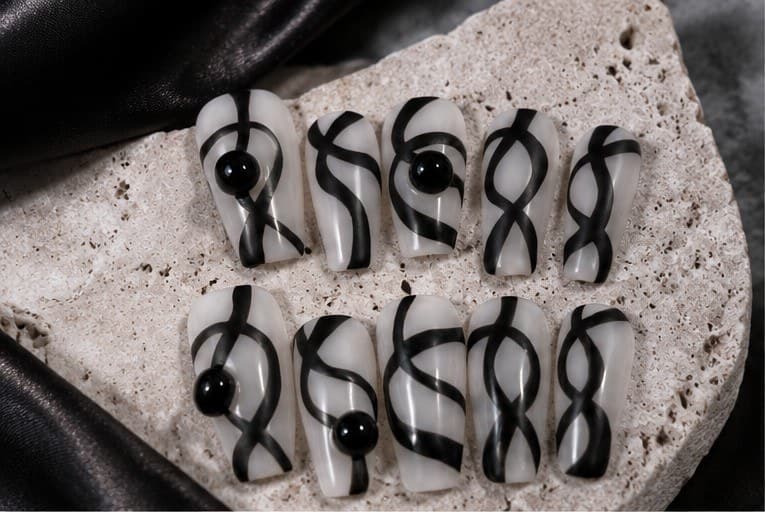 Wild Factor Designer Press-On Nails – Abstract Black Line-Art, Hand-Painted Milky Base | Handmade Nail Art image